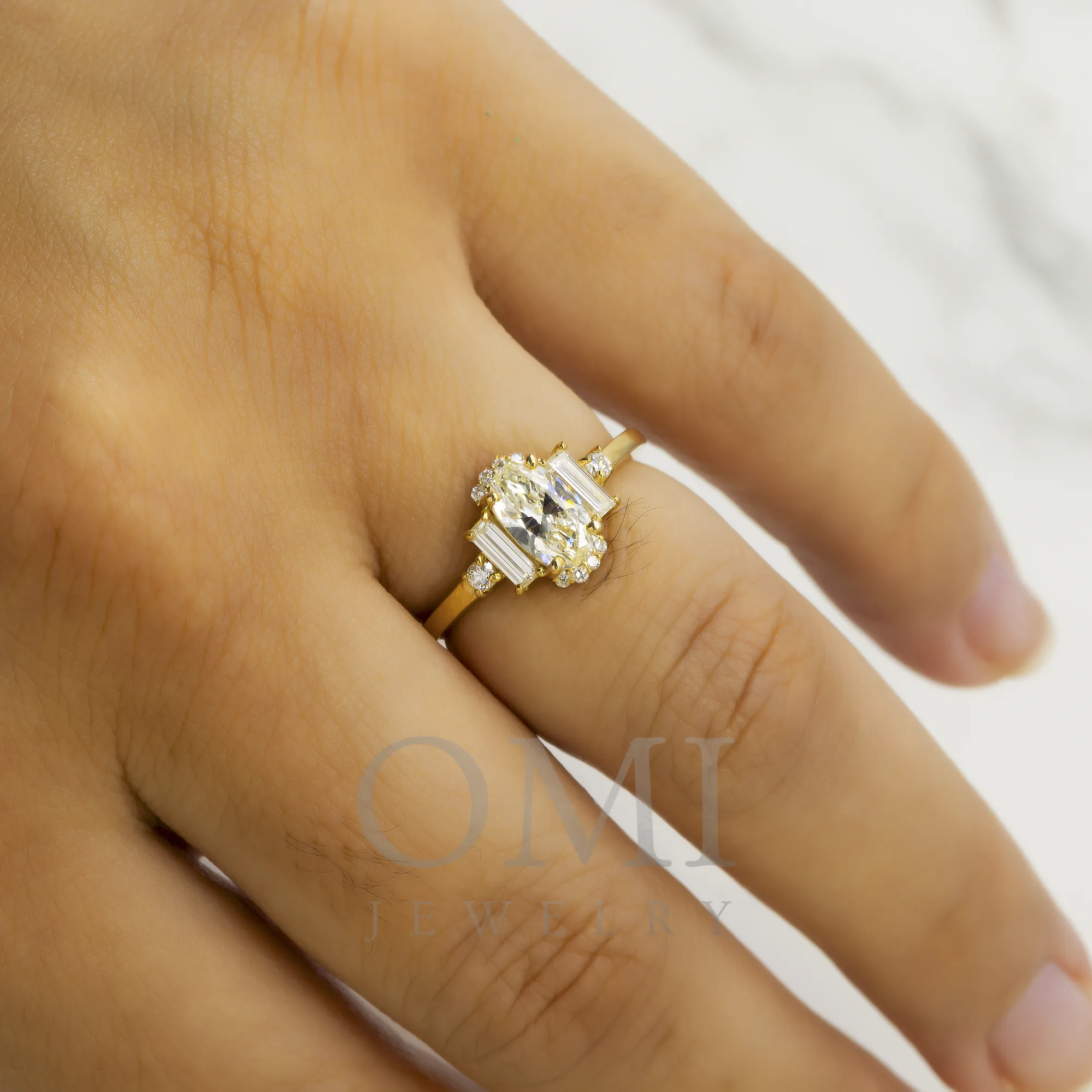 14K GOLD OVAL AND BAGUETTE DIAMOND ENGAGEMENT RING 1.25 CTW all